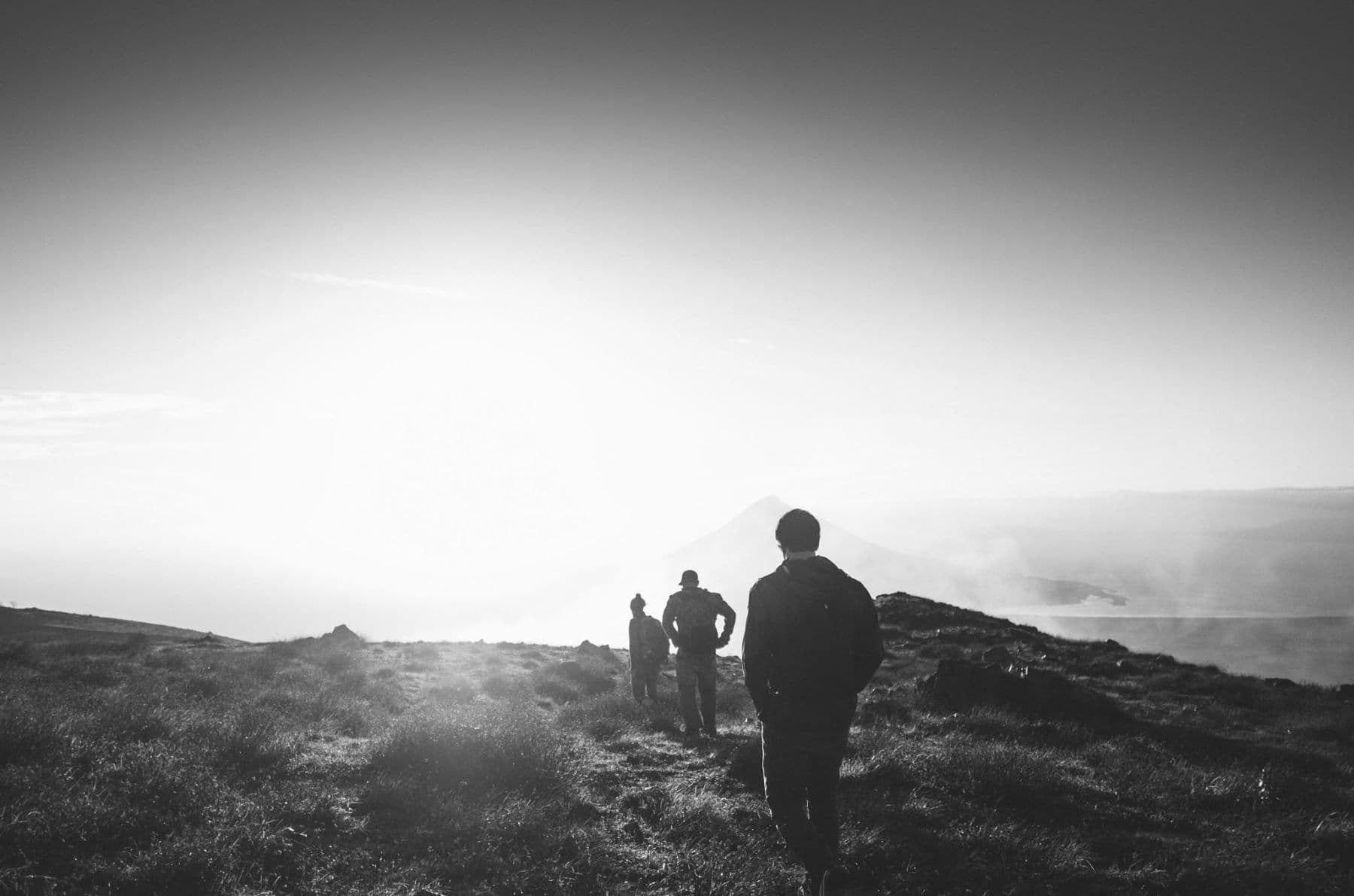 Walking across a ridge at sunset